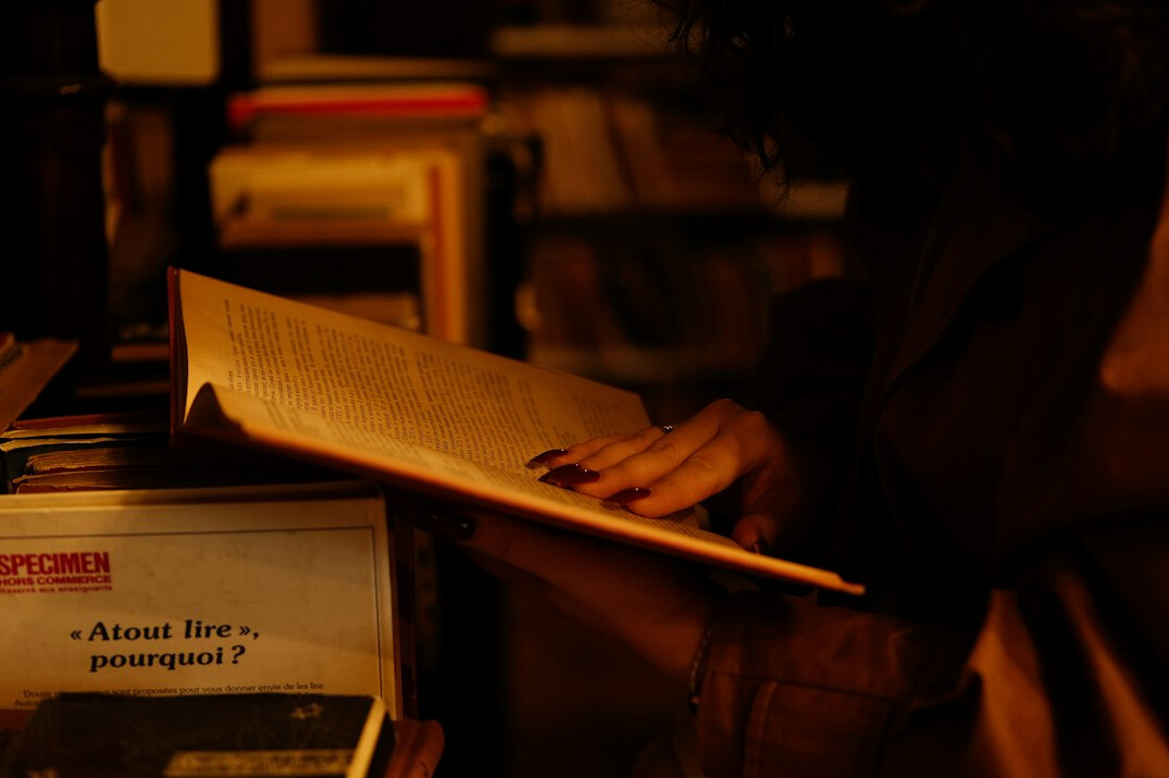 detective examining clues in book