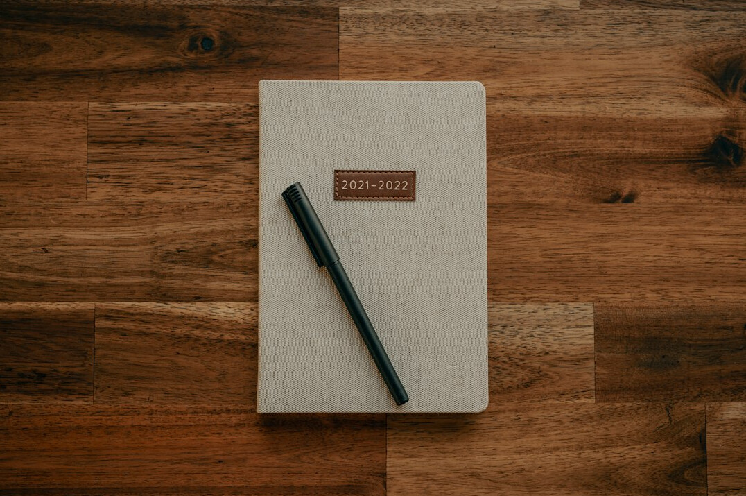 writer at desk with notebook