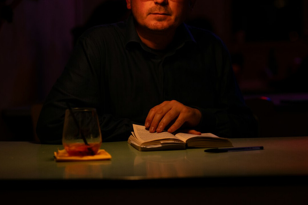 detective examining clues in book